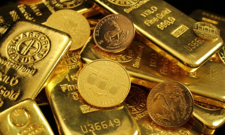 A pile of gold bars and coins.