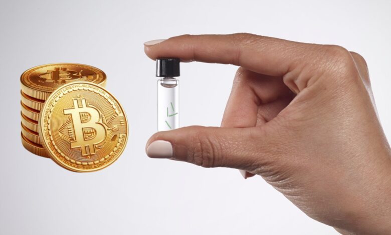 Stack of Bitcoin next to a hand holding biotech vial.