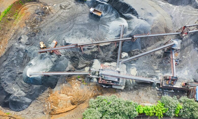 Heavy equipment and trucks operating at lithium mine.