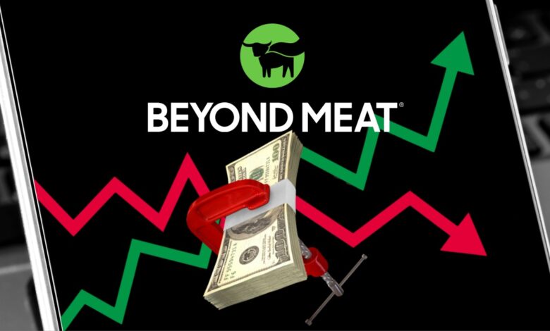 Beyond Meat logo with up and down stock chart arrows on smartphone background.