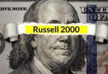 The words "Russell 2000" underneath ripped U.S. dollar bill.