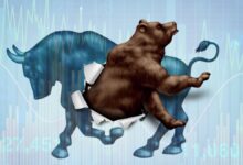 A bear bursts through the body of a bull, symbolizing a shift from a bull market to a bear market, with financial charts in the background.